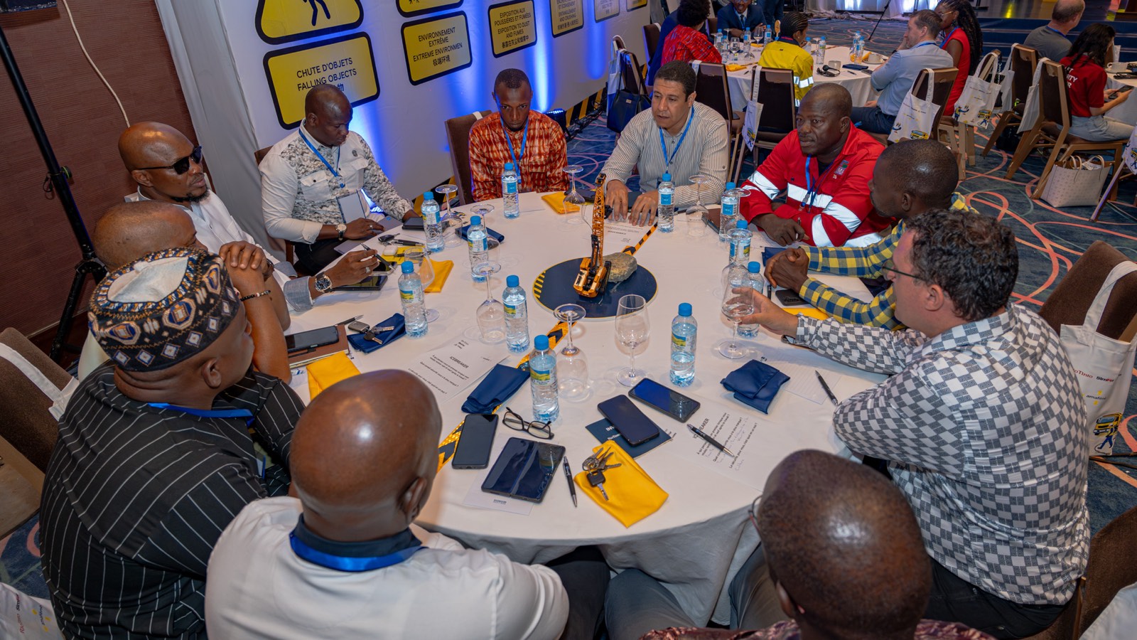 Forum participants gathered around a working table, discussing critical controls and incident-prevention practices.