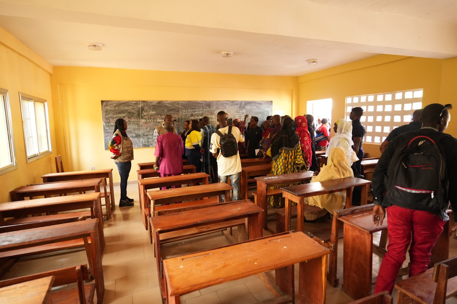 Visitors in a classroom of the High School of Beyla